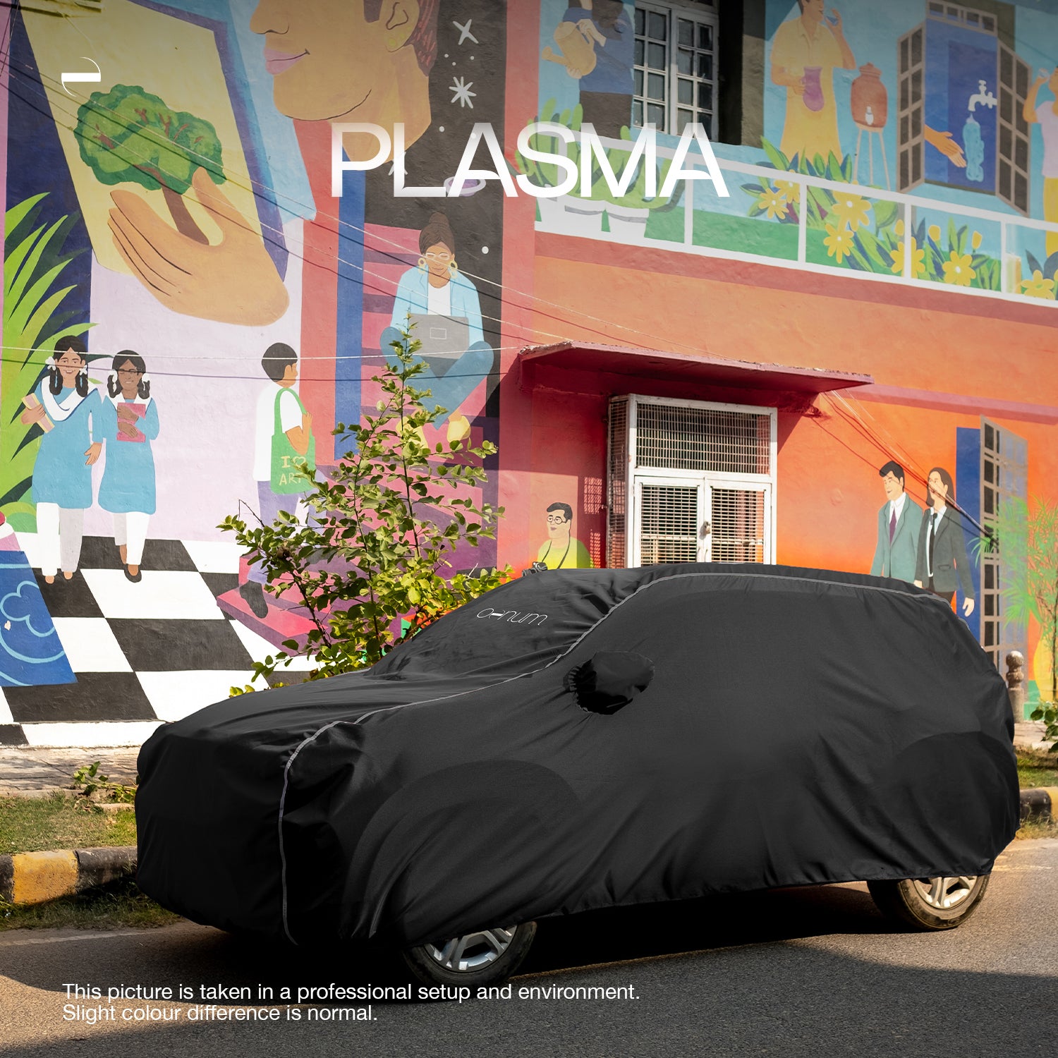 Side Lifestyle shot of Oenum plasma black custom fit car cover on a car parked on society's surrounding street with colorful mural backdrop