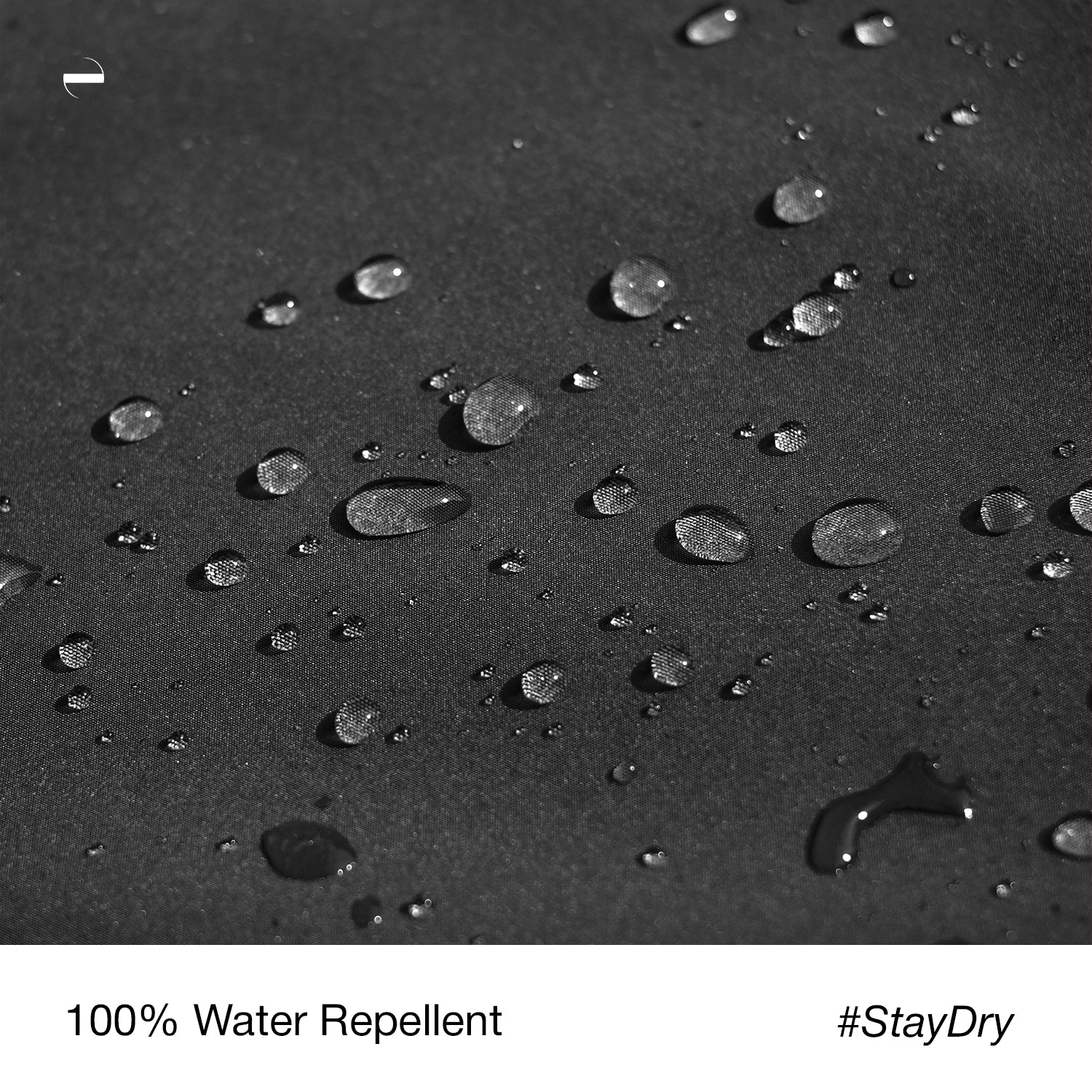 Close-up macro photo of the OENUM Plasma car cover's black fabric surface, showing dozens of intact water droplets beading on top without soaking into the weave, demonstrating water-repellent performance; caption below reads '100% Water Repellent #StayDry.'