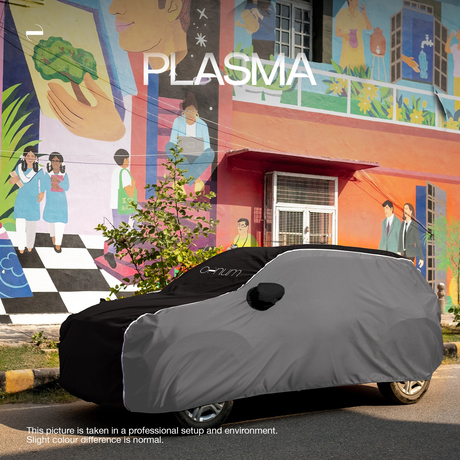 Side Lifestyle shot of Oenum plasma black grey custom fit car cover on a car parked on society's surrounding street with colorful mural backdrop